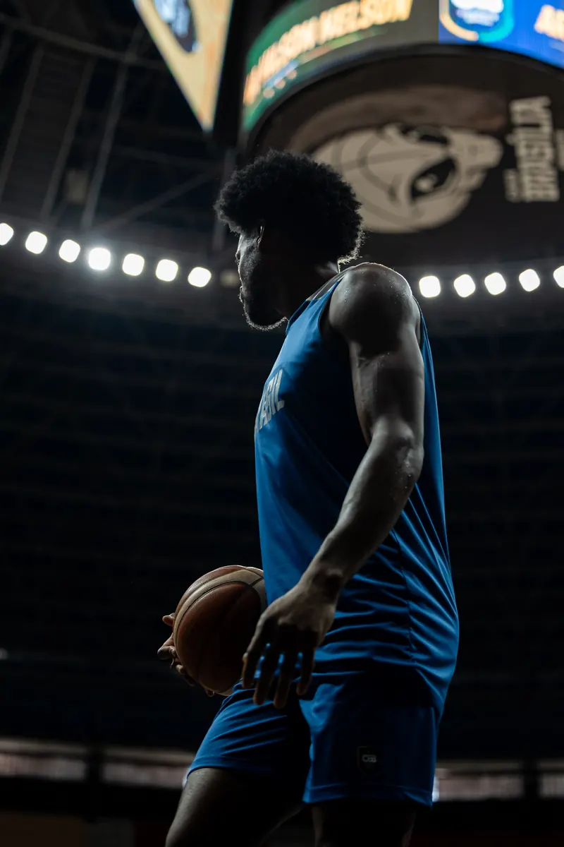 Player silhouetted under the arena lights during practice