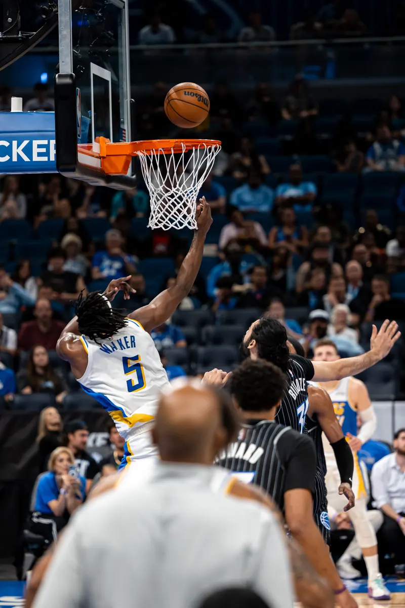 Layup attempt at the rim as defenders collapse